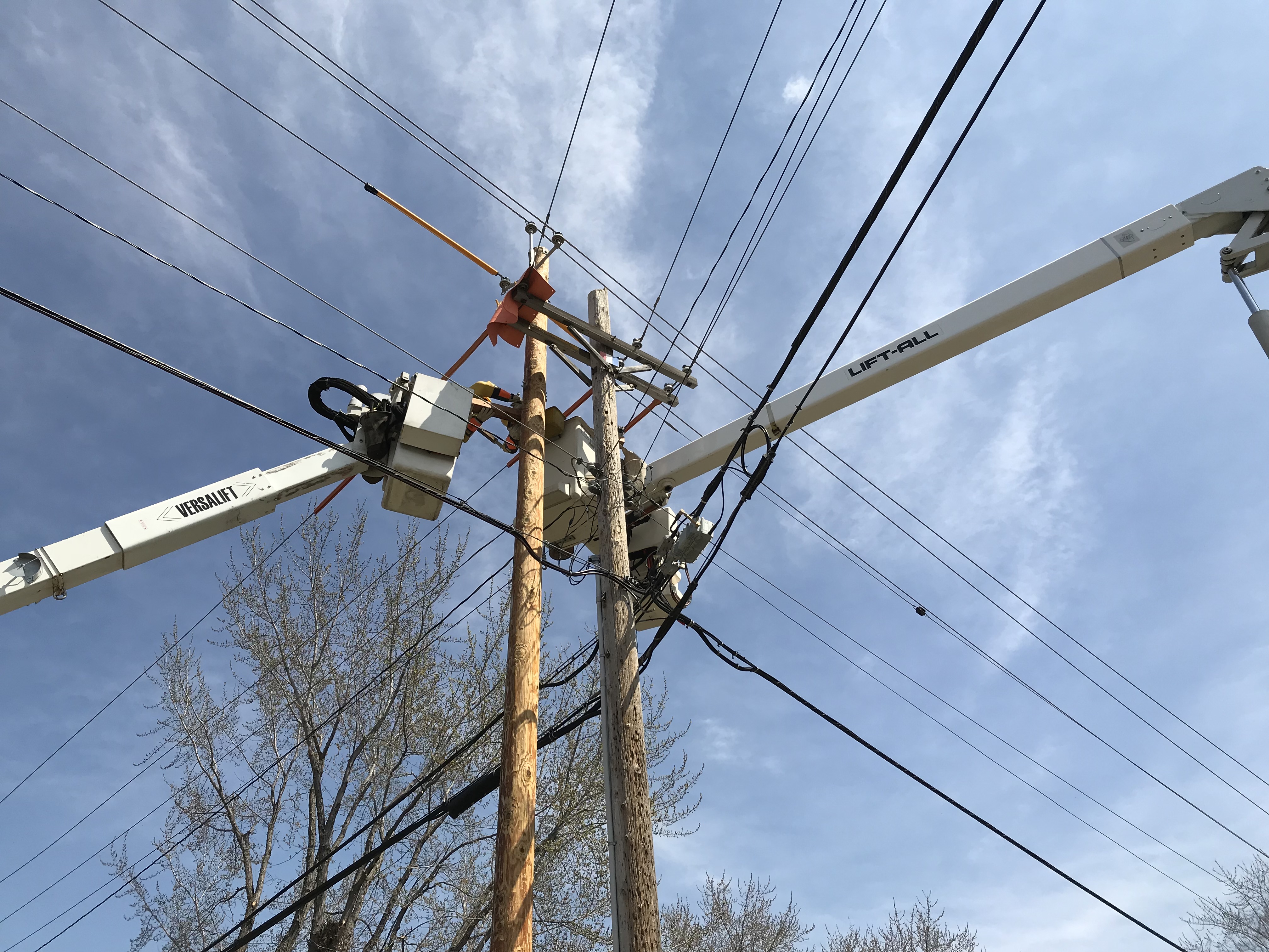 Cherry Picker Performing Maintenance on Power Lines